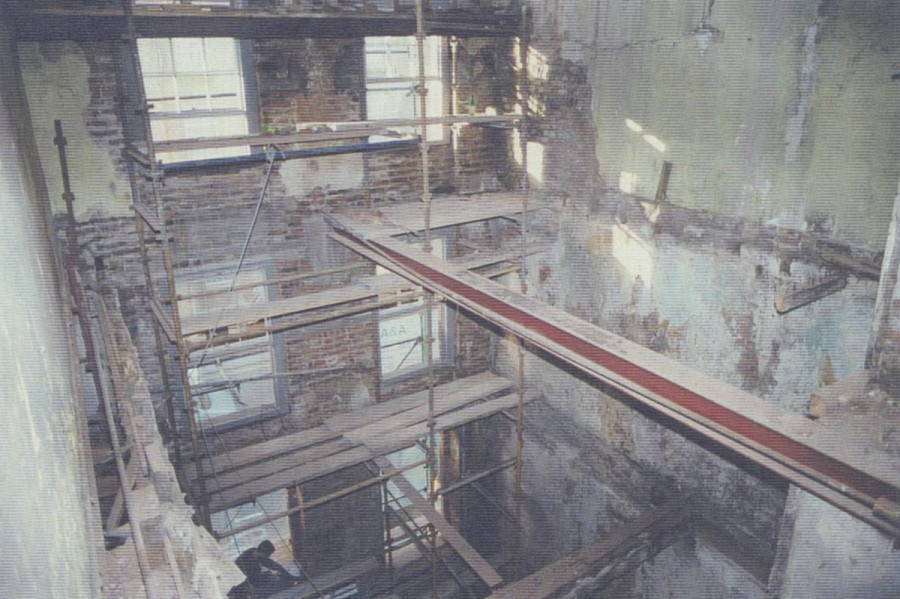 View down through the house showing the extensive collapse of internal structures