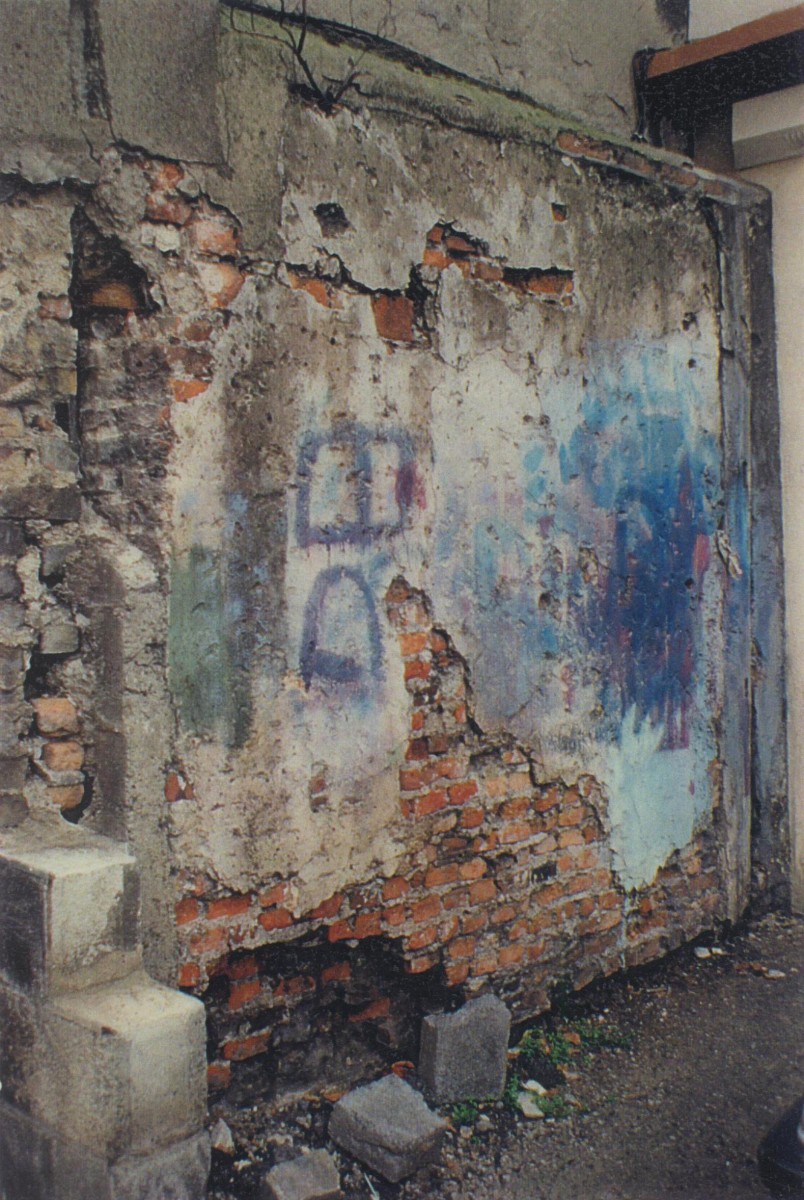 Early panel of brickwork and timbers embedded in the western party wall of Number 4
