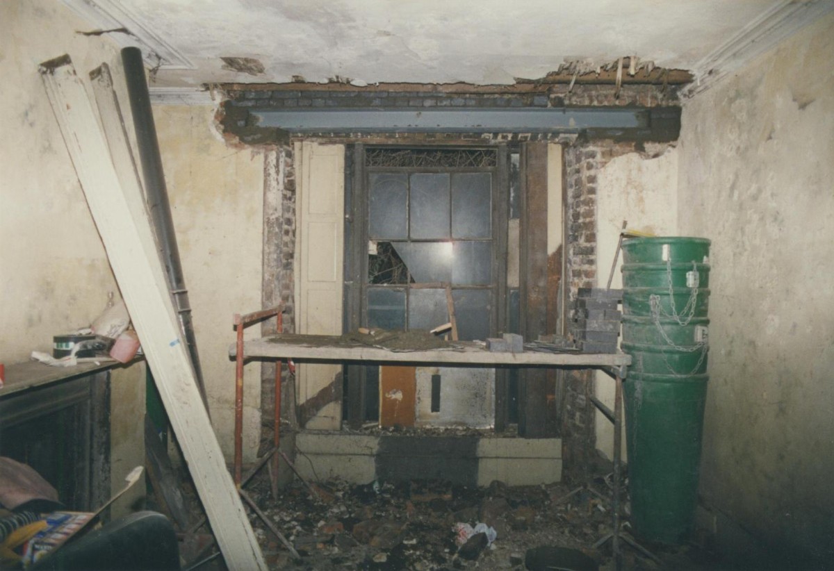 Rear room under renovation in the 1990s showing replacement window head 